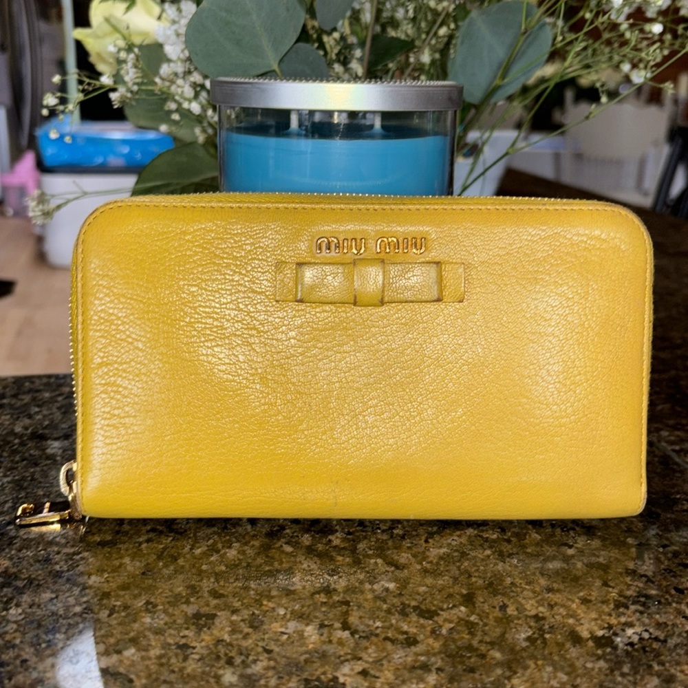 Miu miu yellow leather large continental zippy wallet. Comes with the cards!!!